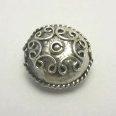 Artisan-crafted 925 sterling silver dome bead featuring intricate Balinese spiral wire scrollwork, central silver sphere granulation, and a twisted rope-wire border with antiqued oxidation.