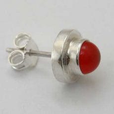Side view of a handcrafted 925 sterling silver stud earring featuring a vibrant red carnelian cabochon set in a stepped tiered bezel with a friction backing post.