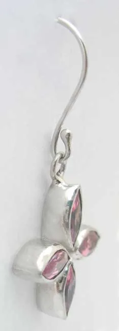 Side perspective view of the handcrafted 925 sterling silver drop earring displaying the thick silver bezel setting profile and wire hook loop.