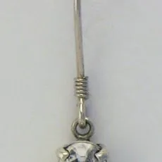 Macro view of a handcrafted 925 sterling silver drop earring featuring an oval faceted clear cubic zirconia gemstone in a four-prong basket setting on a French wire hook with coiled wire detail.