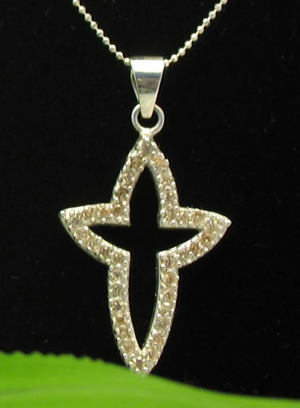 Handcrafted 925 sterling silver openwork flared cross pendant with micro-pave set sparkling gemstone accents.