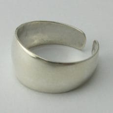 Artisan-crafted 925 sterling silver open band ring with a wide polished face on a plain background.
