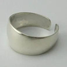 Artisan-crafted 925 sterling silver open band ring with a wide polished face on a plain background.