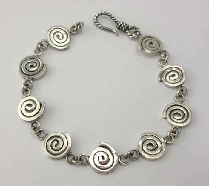 Artisan-crafted 925 sterling silver chain bracelet with intricate spiral swirl links and a twisted S-hook clasp on a plain background.