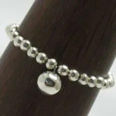 An artisan-crafted 925 sterling silver beaded bracelet featuring a smooth, polished circular disc pendant charm.