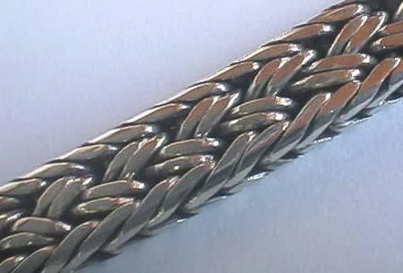 Close-up detail of the artisan 925 sterling silver dragonspine woven chain structure, showing intricate interlocking silver wire hand-craftsmanship.