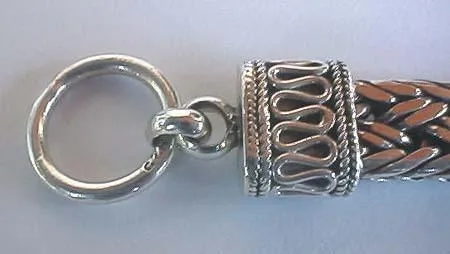 Detailed view of the sterling silver T-bar toggle clasp featuring ribbed end caps attached to an artisan Balinese filigree end cap.