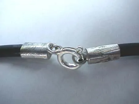 Close-up of a 925 sterling silver spring-ring clasp and textured end caps securing a black necklace cord.