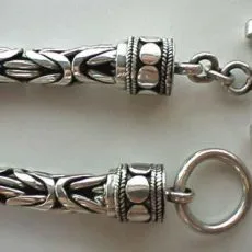 Artisan-crafted 925 sterling silver Borobudur chain necklace showing the T-bar and O-ring toggle clasp attached to detailed Balinese dotwork end caps.