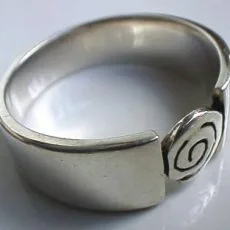 Hand-forged 925 sterling silver wide band ring featuring a smooth polished finish and a unique Balinese-style spiral wrap design.