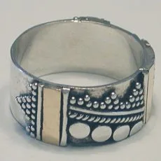 Artisan-crafted wide 925 sterling silver band ring featuring panels of gold-toned metal accents and intricate Balinese jawan granulation motifs.