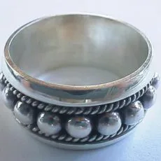Artisan-crafted 925 sterling silver wide spinner look band ring showcasing large polished center beads and oxidized twisted rope details in traditional Bali style.