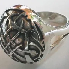 Artisan-crafted 925 sterling silver statement dome ring featuring an intricate abstract lattice overlay contrasting against a dark oxidized background, shown from a three-quarter side angle highlighting the split-shank band.
