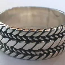 Artisan-crafted wide 925 sterling silver band ring featuring a detailed Balinese braided wheat chain pattern with oxidized contrast.