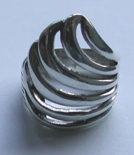 Bold Balinese-style 925 sterling silver wide band ring featuring an architectural layered wave motif and fluid open spaces, captured from an elegant top-down perspective.