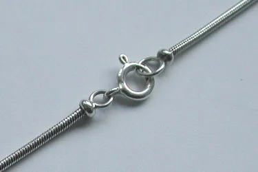 Close-up detailed view of a high-purity 925 sterling silver snake chain highlighting a polished classic spring ring clasp and clean artisan link work.