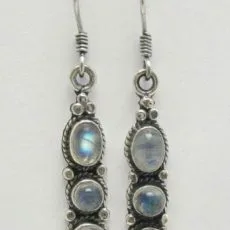 A pair of artisan-crafted dangle earrings featuring three vertical oval moonstone gems set in 925 sterling silver with intricate twisted wire detailing and hook backings.