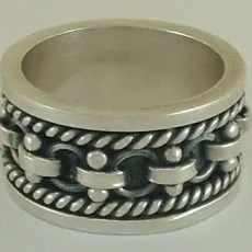 Wide sterling silver band ring with a central chain link pattern, twisted rope borders and dark oxidized accents.