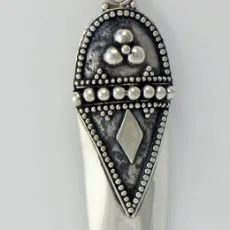 Front view of a handcrafted 925 sterling silver long shield-shaped drop earring, featuring a smooth tapered base and an oxidized top section adorned with beaded trim, geometric patterns, and raised silver dots, suspended from a french wire.