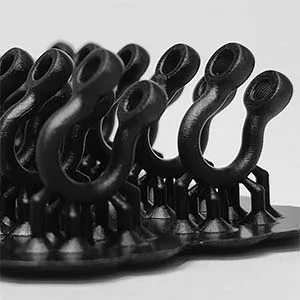 A detailed view of multiple U-shaped artisan jewelry shackle lock components with internal threading, expertly 3D printed in premium dark resin for custom prototype testing and casting preparation.